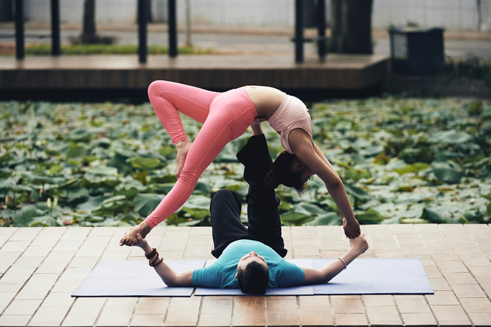 What’s the difference between Partner Yoga and AcroYoga?